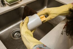 A Person Washing a Mug