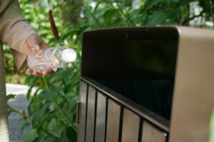 A Person Throwing a Plastic Bottle